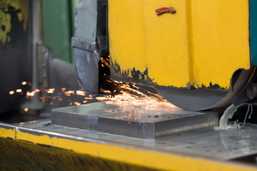 finishing metal working on horizontal surface grinder machine with flying sparks