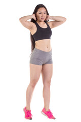 Beautiful fitness woman standing - isolated over a white backgro