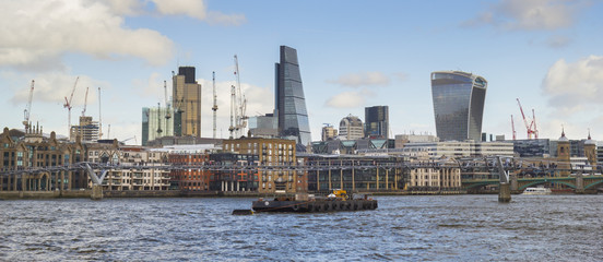 Obraz premium London City Skyline with Millennium bridge and construction cranes