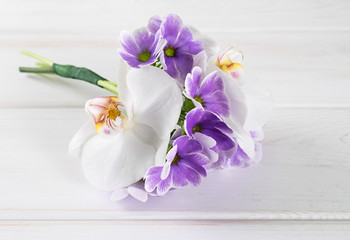 Bouquet of primroses and orchid