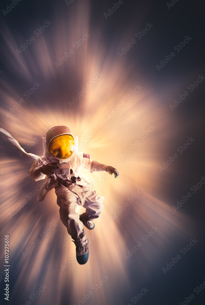 Wall mural astronaut floating in the atmosphere