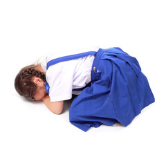 beautiful little girl in school uniform sleeping isolated white