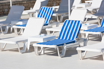 Hotel Poolside Chairs near a swimming pool