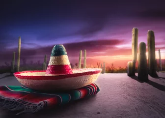 Foto op Aluminium Mexican hat "sombrero" on a "serape" in a mexican desert at twil © fergregory