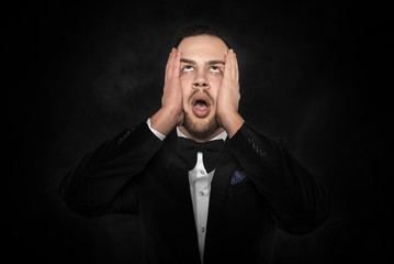 Man feeling a headache or intensely thinking.