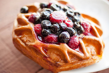 Fresh tasty danish with wild berries