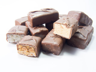 assorted chocolate bars on white background 