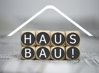 Würfel mit Hausbau