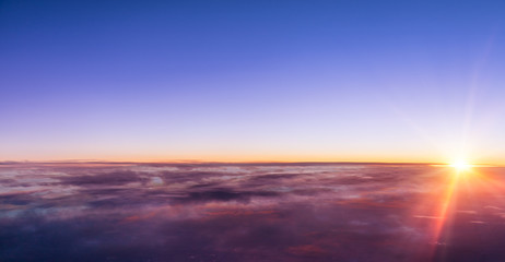 Beautiful sunset above clouds