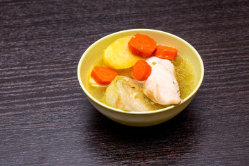 Tatar national Lagman soup with meat and vegetables and a piece