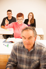 Fototapeta premium Group of people of different age sitting in classroom and attend