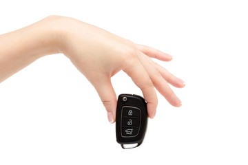 Female hand holds car keys.