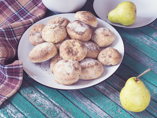 Stillife with cookies and pears on a rustic table