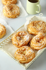 Sweet and tasty eclairs on a white background