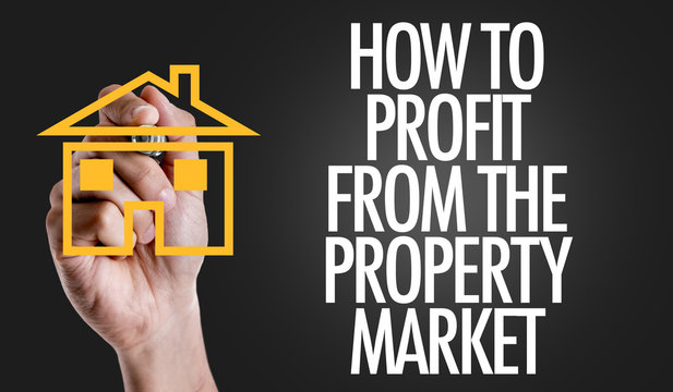 Hand writing the text: How To Profit From The Property Market
