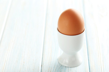 Boiled egg on a blue wooden table