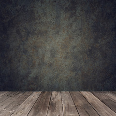 Empty wooden table against a dark wall