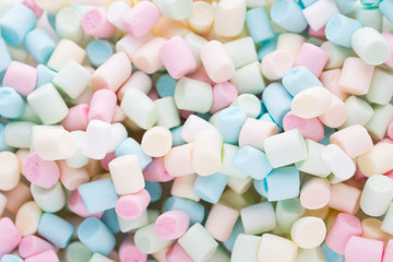 Background or texture of colorful mini marshmallows.