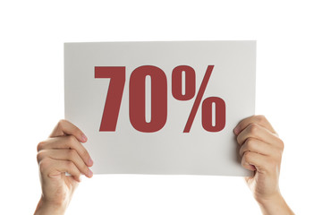 Hand holding a banner with the words 70 percent