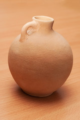 Pitcher, vintage, ethnic, clay ,table, beige, with a narrow neck