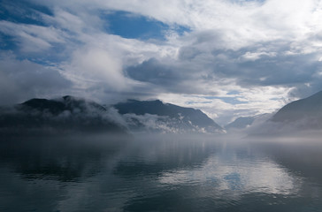 Fototapeta na wymiar Changeable weather on the fjord.