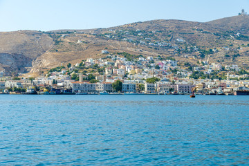 Fototapeta premium Entering the port of Syros, Cyclades. Panoramic view of the trad