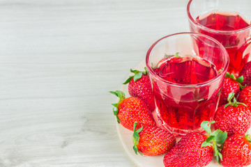 strawberry juice, surrounded by strawberries