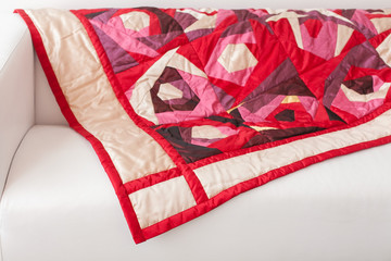 Patchwork quilt. Part of patchwork quilt as background. A blanket in style patchwork. Color...