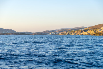 Sailing off from Syros port. Deep blue sea in the foreground.