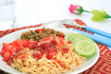 Noodle / Noodle with Pile of chopped fresh tomato and pork on white plate placed on the table.
