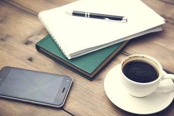 notebook, pen, coffee and phone