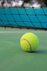 Tennis ball on tennis court