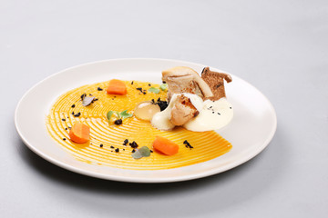 chicken breast with vegetables on a white plate.