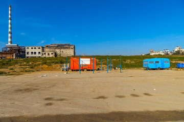 Fototapeta na wymiar Old factory building in Piraeus, Athens. Clear blue sky in the b