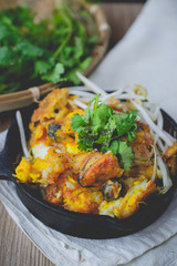 fried mussel pancake with old wooden background