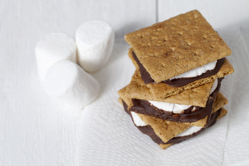 high angle shot of smores sandwich and marshmallow.