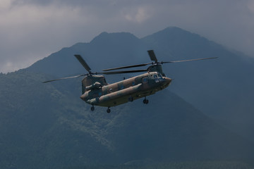 Fototapeta na wymiar Modern military helicopter with twin rotars
