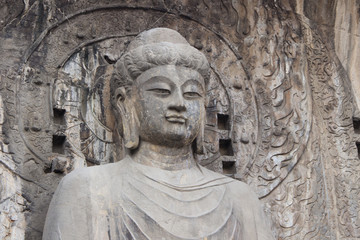 Fototapeta na wymiar Budha's statue at Longmen Grottoes, Luoyang, Henan, China