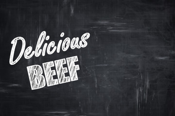 Chalkboard background with chalk letters: Delicious beef sign