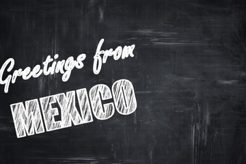 Chalkboard background with chalk letters: Greetings from mexico