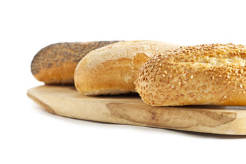cropped image of breads on the wooden plank