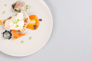 chicken breast with vegetables on a white plate.
