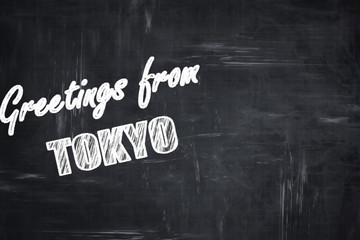 Chalkboard background with chalk letters: Greetings from tokyo