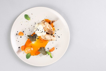 chicken breast with vegetables on a white plate.