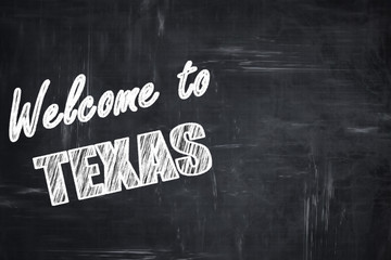 Chalkboard background with chalk letters: Welcome to texas
