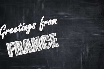 Chalkboard background with chalk letters: Greetings from france