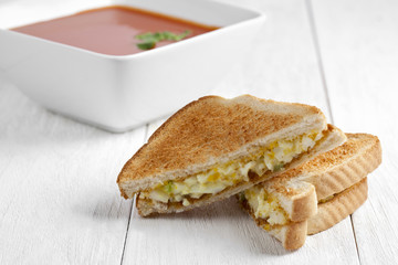 breakfast sandwich with egg and tomato soup