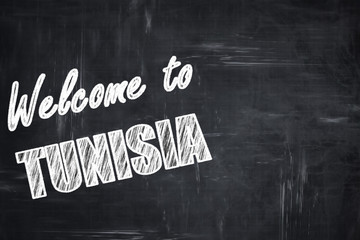 Chalkboard background with chalk letters: Welcome to tunisia