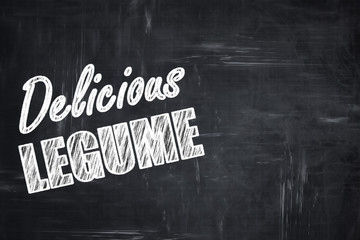 Chalkboard background with chalk letters: Delicious legume sign