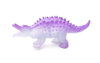side view purple plastic dinosaur toy on a white background